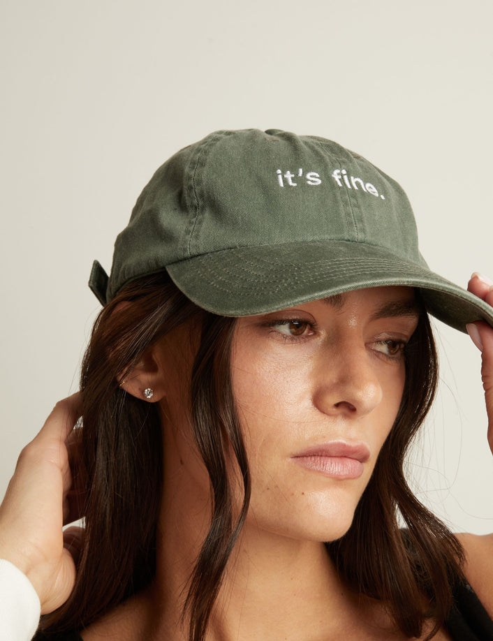 Woman wearing a green cap with 
