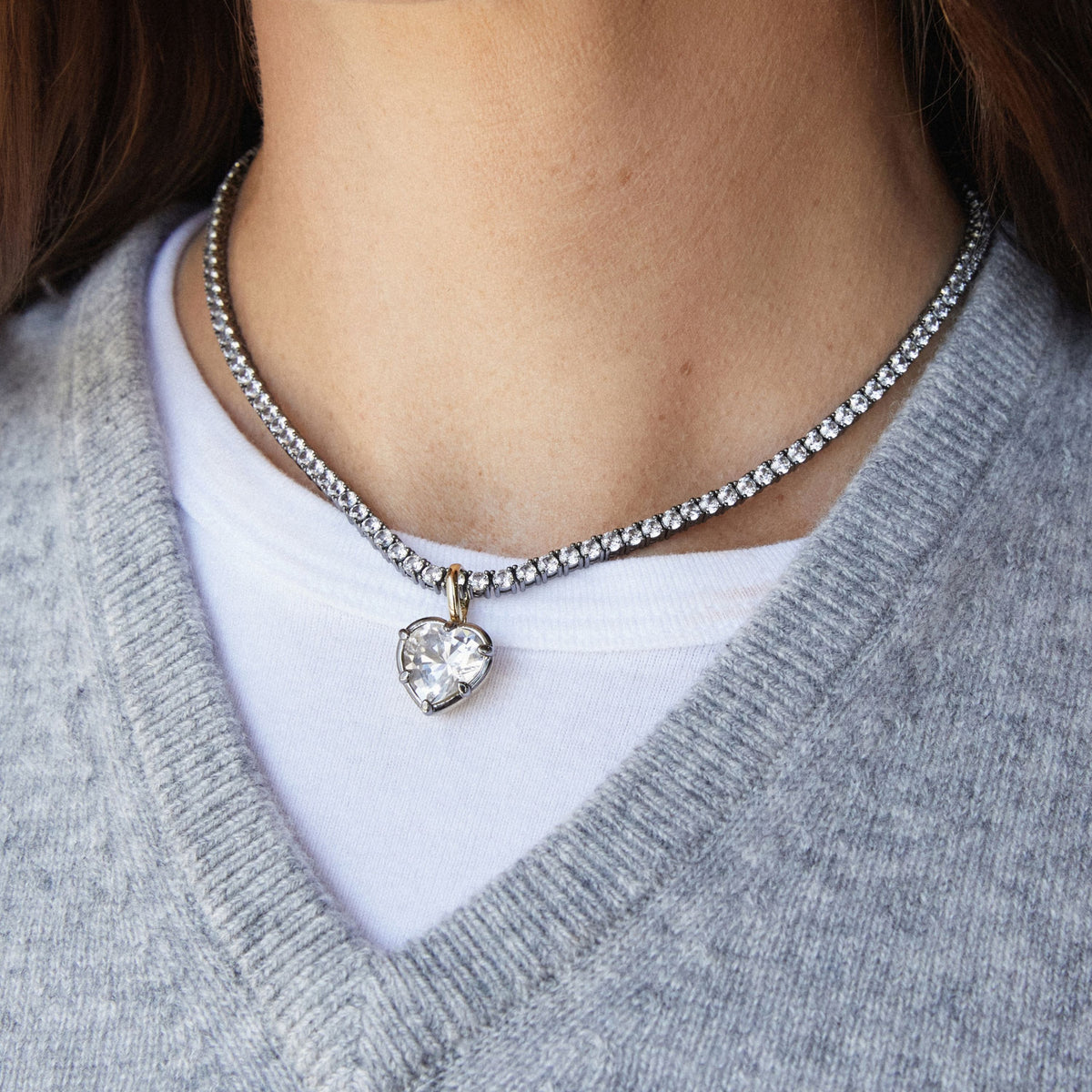 Model. Close up of woman wearing a Heart Georgian Pendant on a tennis necklace
