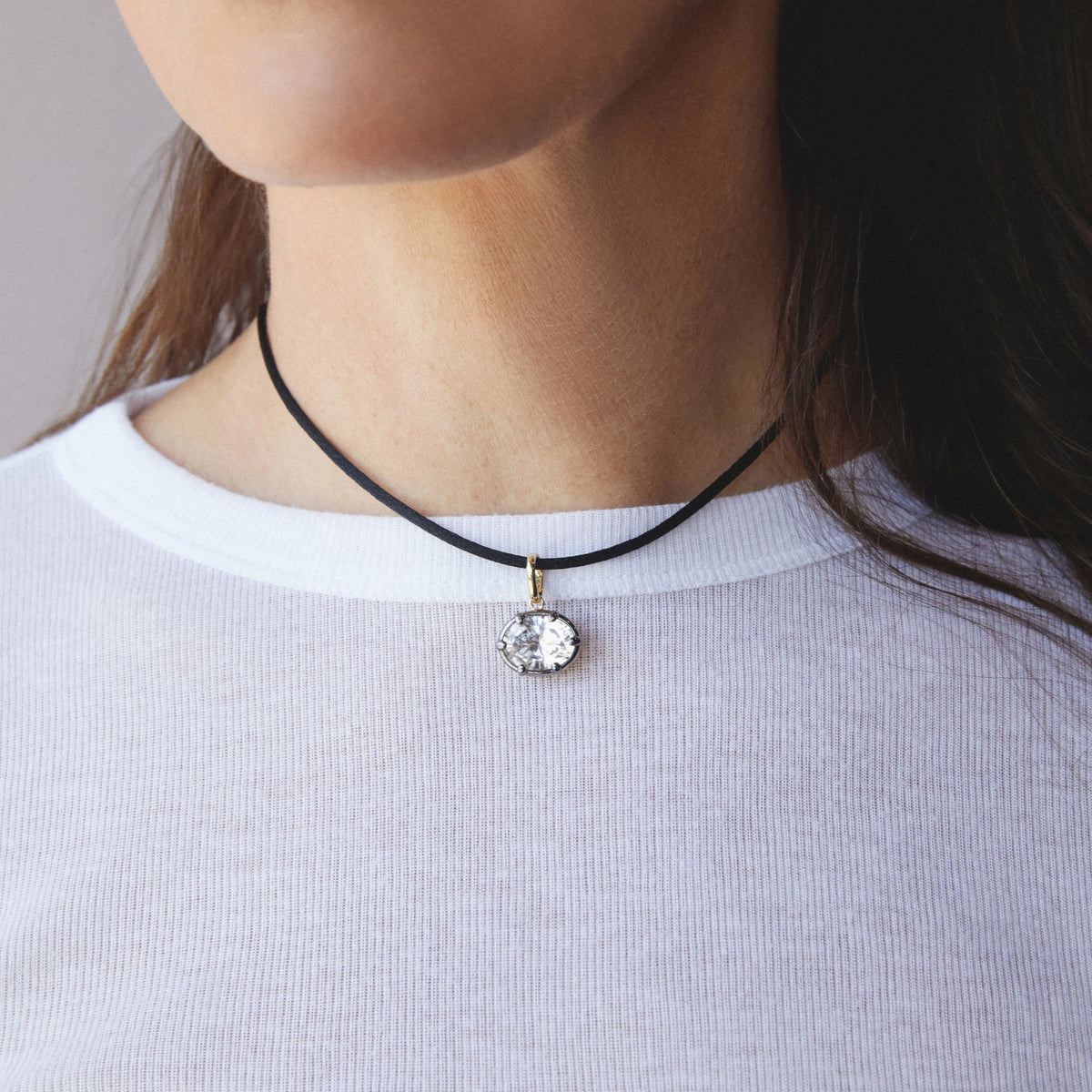 Model. Close up of woman wearing an Oval Georgian Pendant on a nylon cord necklace