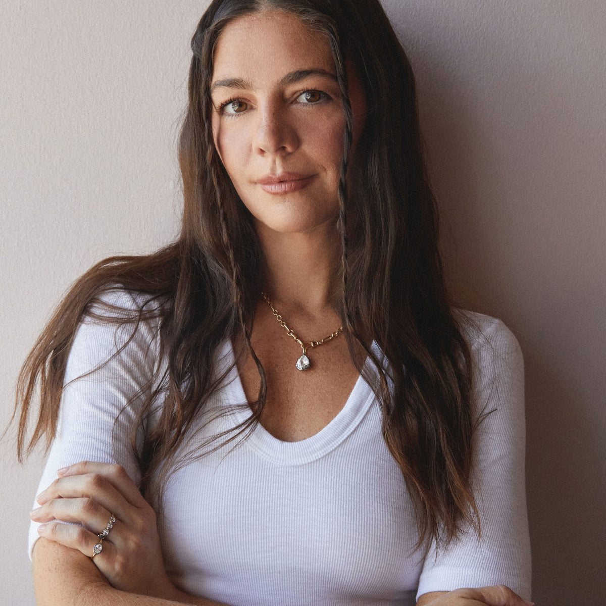 Model. A woman wearing a chain necklace with a Pear Georgian Pendant. 