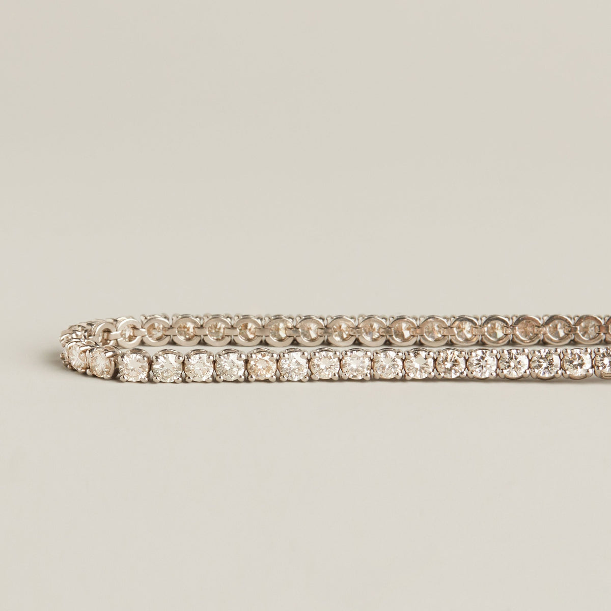 Model. A diamond tennis bracelet on neutral background