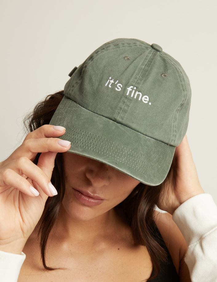 Model. Woman wearing a green cap with 