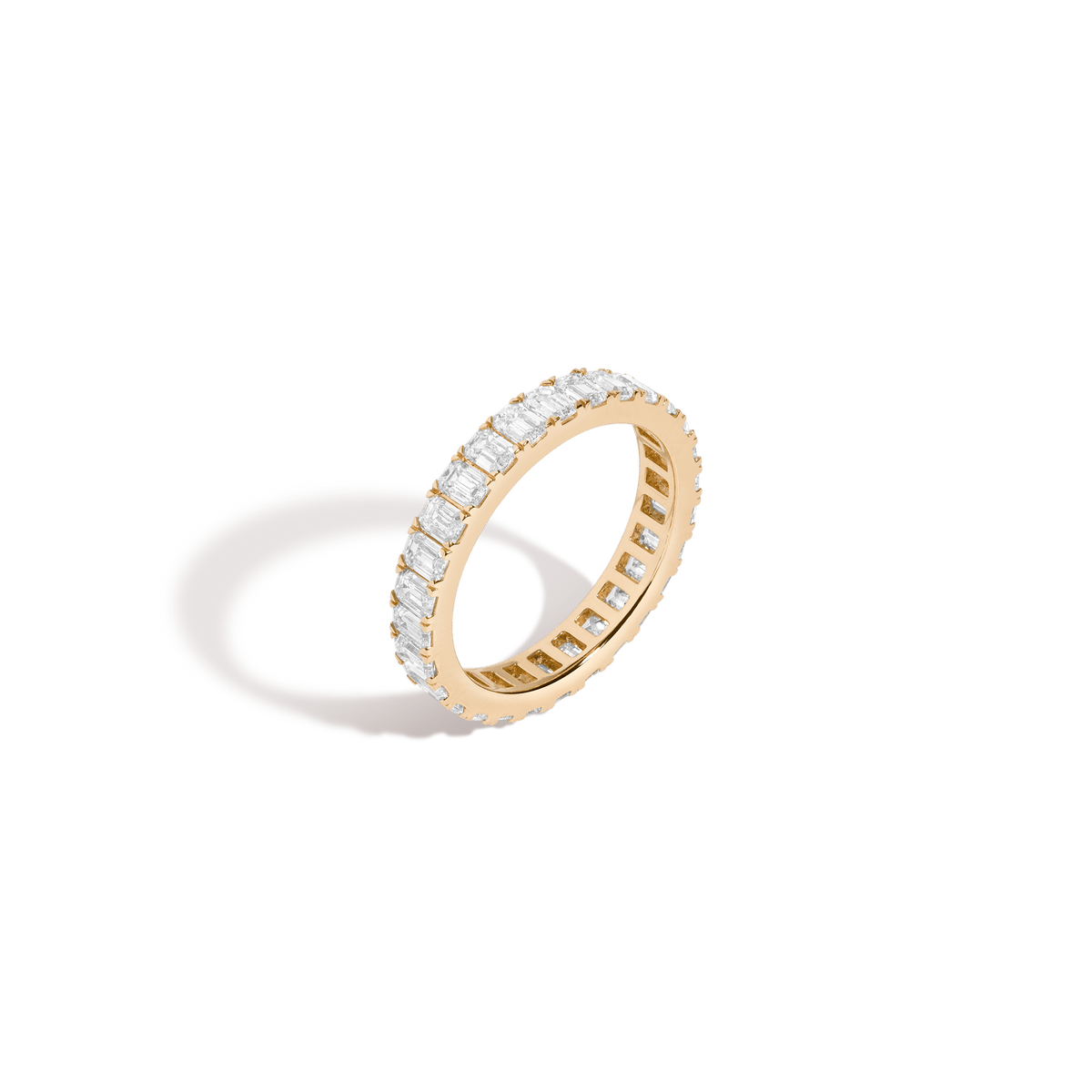 Emerald eternity 2025 band yellow gold