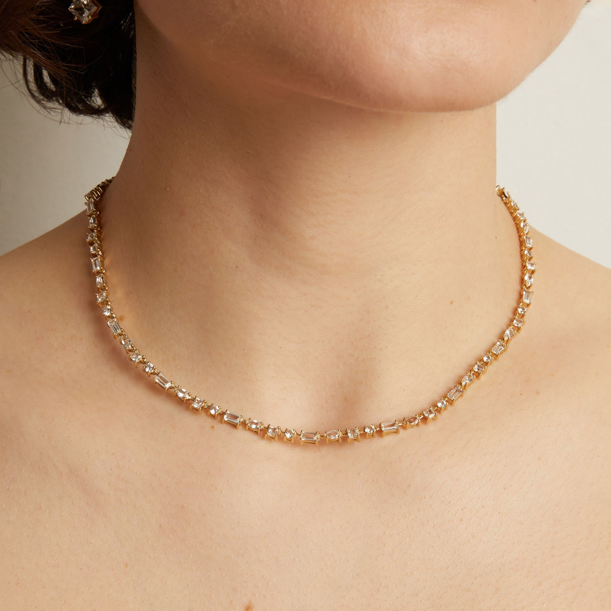 Model. Mixed shape tennis necklace on a person