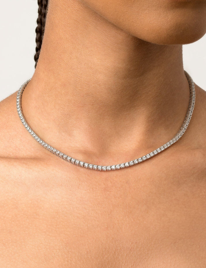 Model. Woman wearing diamond tennis necklace