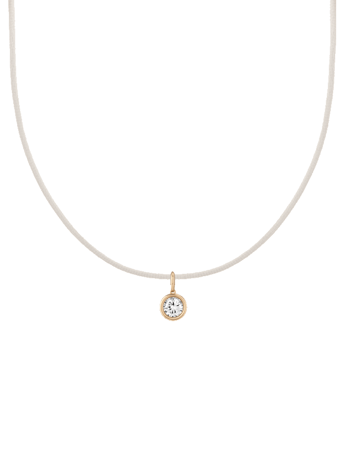 First. Gif of cord necklace with bezel white sapphire charm pendant. 