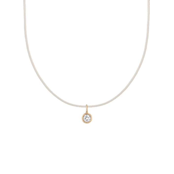 First. Gif of cord necklace with bezel white sapphire charm pendant. 