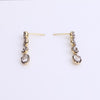 Video of black rhodium tennis earrings on white background.