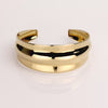Video of a gold cuff bracelet on white background.