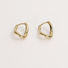 Gold hoop earrings on white background.