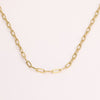 Video of gold chain necklace on white background.