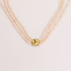 Video of pearl necklace on white background