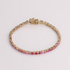 Video of pink tennis bracelet on white background.