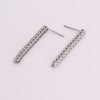 Video of tennis earrings on white background.