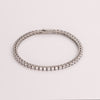 Video of white sapphire tennis bracelet on white background.