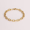Video of a gold chain bracelet on white background.