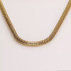 Video of a gold chain necklace on white background.