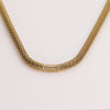 Video of a gold chain necklace on white background.