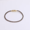 Video of black tennis bracelet on white background