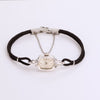 Video of silver watch with black rope band on white background