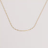 Video of gold chain necklace on white background.