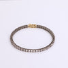 Video of black tennis bracelet on white background