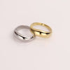Video of a silver and gold ring on white background.