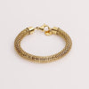 Video of a gold chain bracelet on white background.