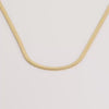 Video of gold necklace on white background.