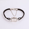 Video of black cord silver watch on white background