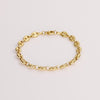 Video of a gold chain bracelet on white background.