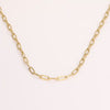 Video of gold chain necklace on white background.