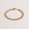 Video of a gold chain bracelet on white background.