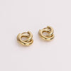 Video of gold hoop earrings on white background.
