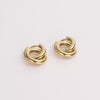 Video of gold hoop earrings on white background.