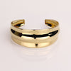 Video of a gold cuff bracelet on white background.