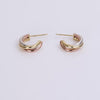Video of silver, gold and rose gold hoop earrings on white background.