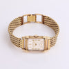 Video of thick gold watch on white background