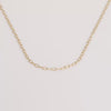 Video of gold chain necklace on white background.