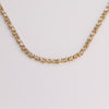 Video of white tennis necklace on white background.