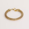 Video of a gold chain bracelet on white background.