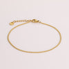 Video of gold chain anklet on white background.