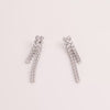 Video of tennis earrings on white background.