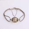 Video of a silver cord watch on a white background
